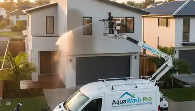 Professional pressure cleaning a Loveland CO home exterior before house painting preparation